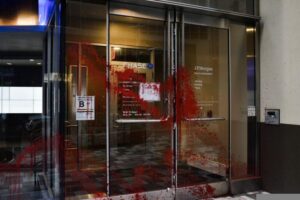 Chase Bank doors splatterd with red paint.