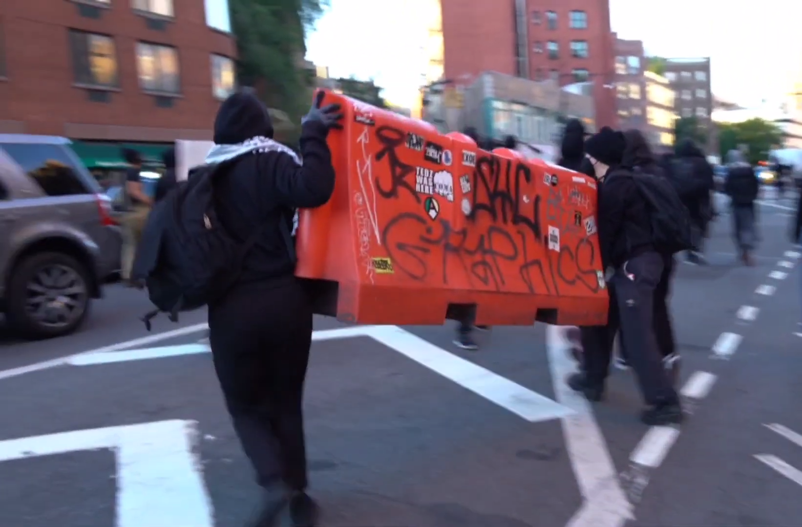 Photos: Pro-Palestine Protesters in Black Bloc Tag Storefronts and Buses, Block Streets